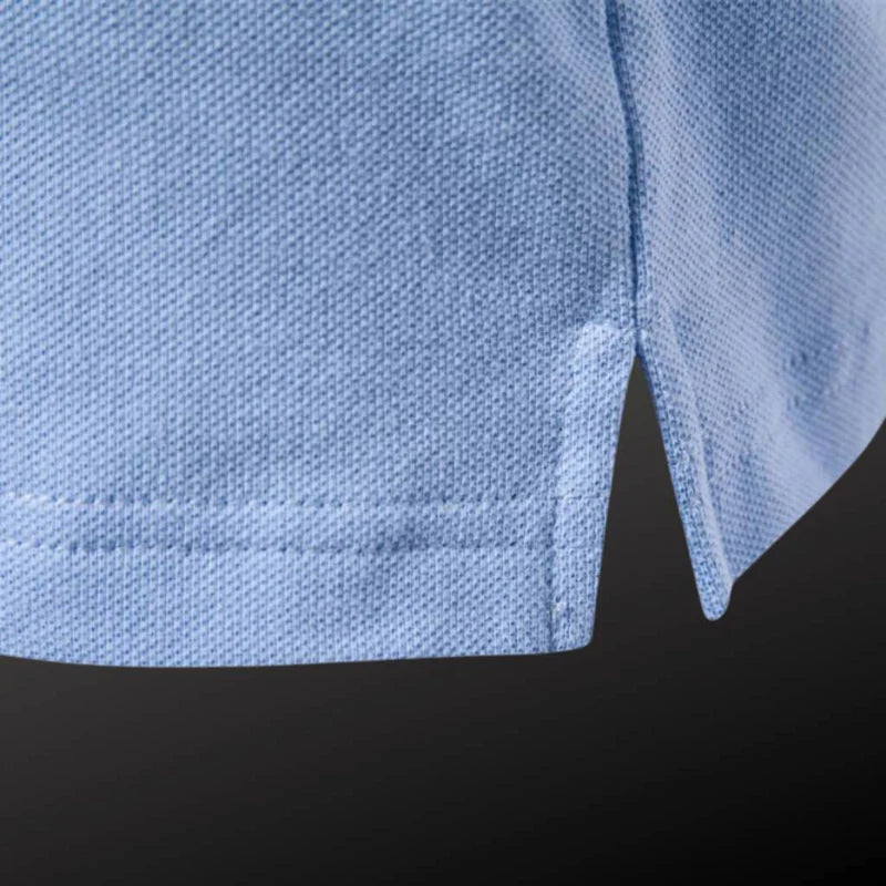 Camisa Polo Masculina Raffenzi RZ150 em algodão, design sofisticado e detalhes bordados que valorizam o visual masculino com elegância e conforto.